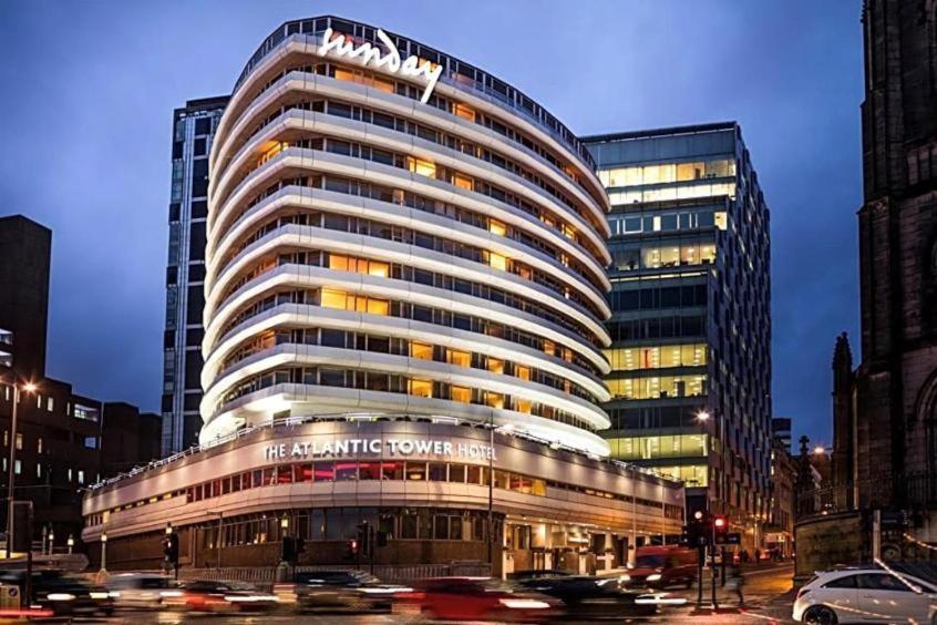 The Atlantic Tower Hotel Liverpool by Sunday illuminated at dusk