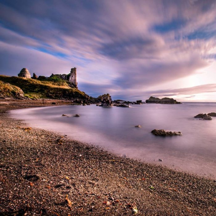 The ruins of Dunure Castle overlooking a rocky Ayrshire shoreline