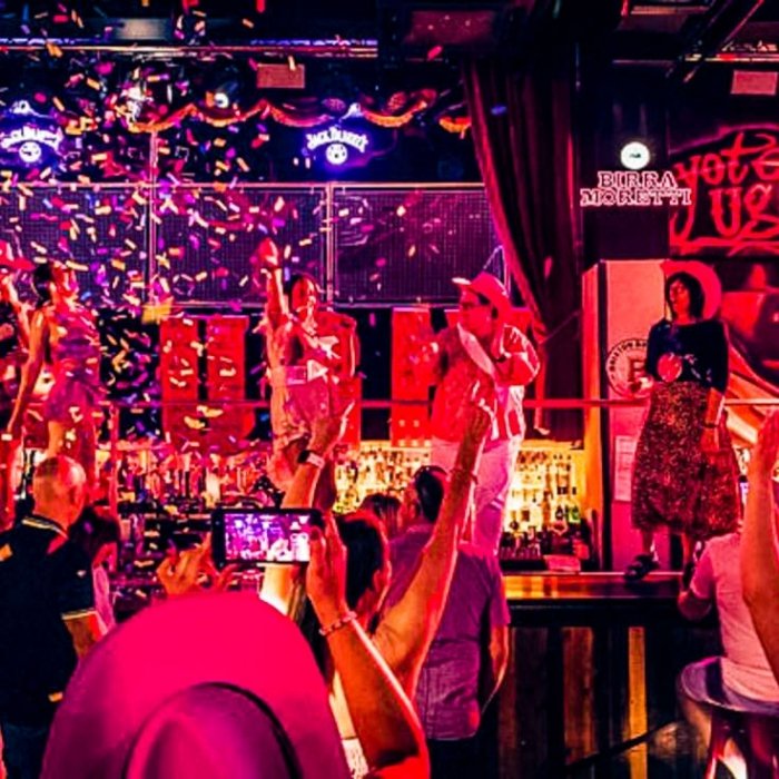Dancers and guests enjoying the colourful Coyote Ugly party atmosphere