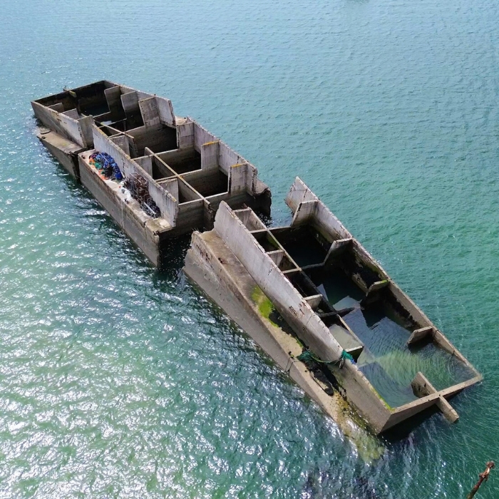 Surviving remains of the Mulberry Harbour at Arromanches