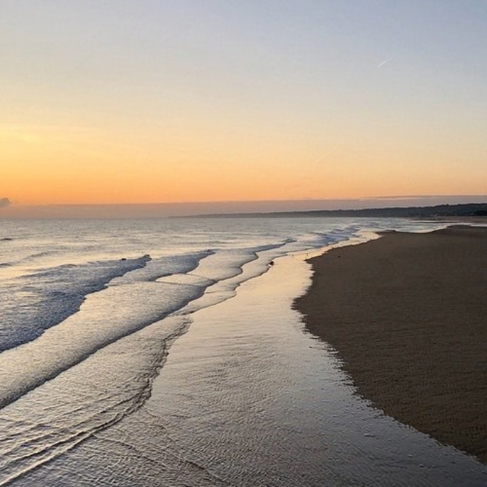 Gentle waves and a quiet sky over Utah Beach