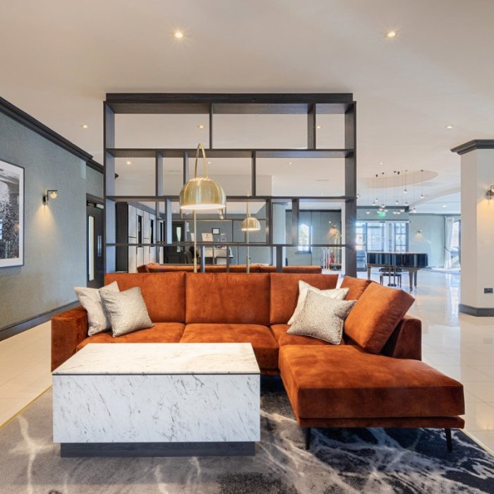 Stylish lounge seating and marble finishes in the Clybaun Hotel’s reception area