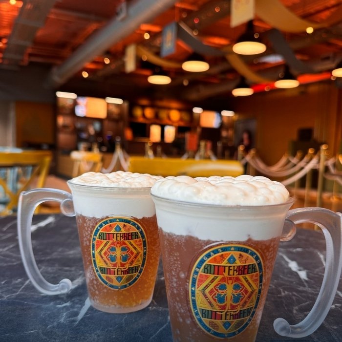 Frothy Butterbeer drinks in souvenir tankards at the Studio Tour