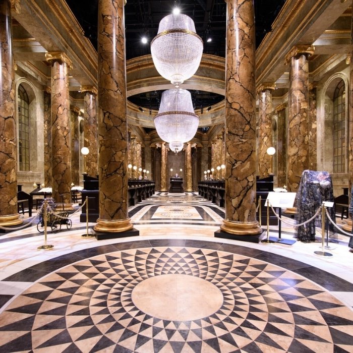 Marble-effect columns and crystal chandeliers in Gringotts Wizarding Bank