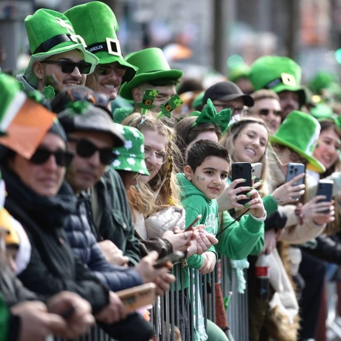 Smiling spectators wearing green at the Letterkenny St Patrick's celebrations