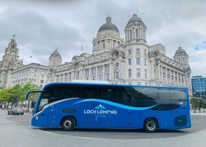 Loch Lomond Travel coach beside Liverpool&rsquo;s waterfront landmarks