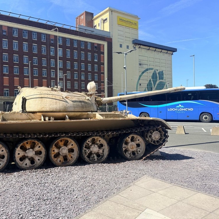 Military vehicle and Loch Lomond Travel coach at Imperial War Museum North