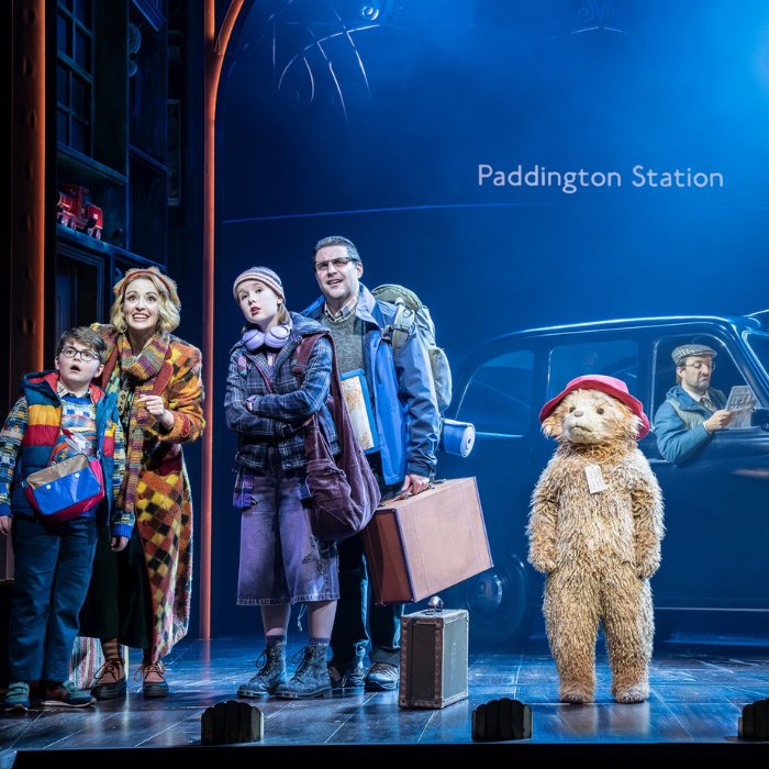 Paddington and the Brown family with their luggage at Paddington Station