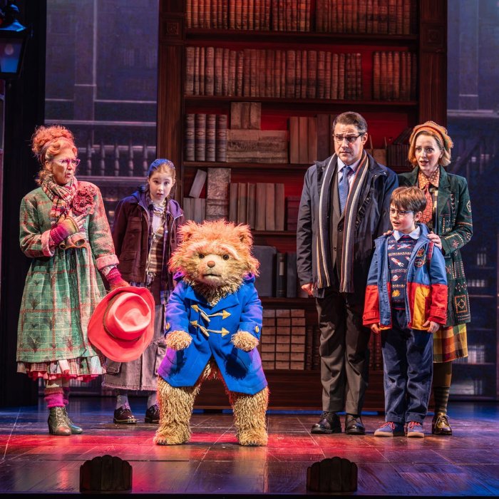 Paddington and the Brown family in a comic moment from the musical