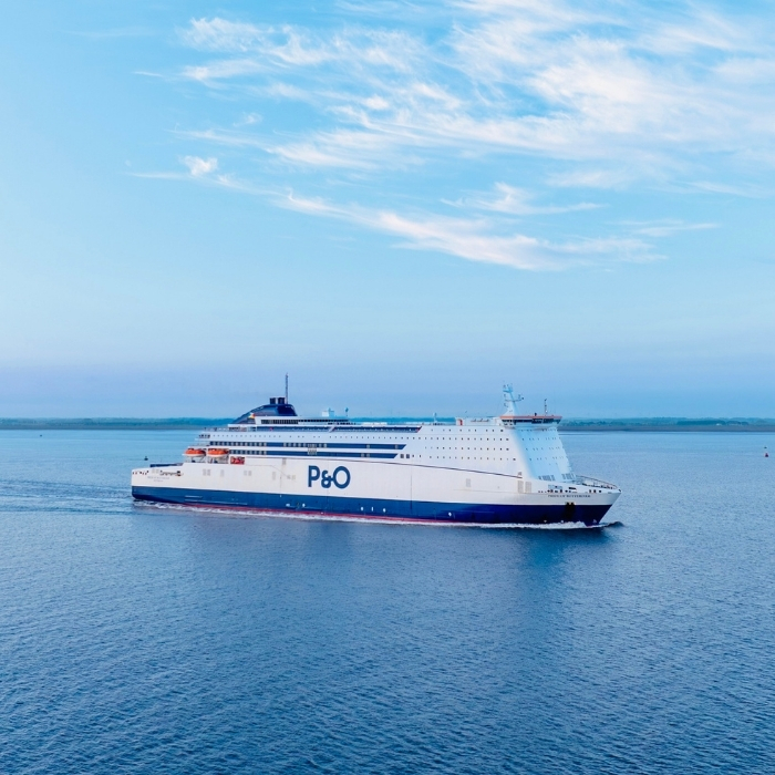 A P&O ferry sailing across calm blue water