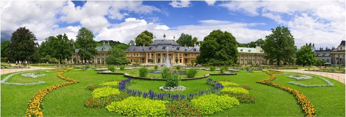 A panoramic view of Pillnitz Palace and its formal gardens