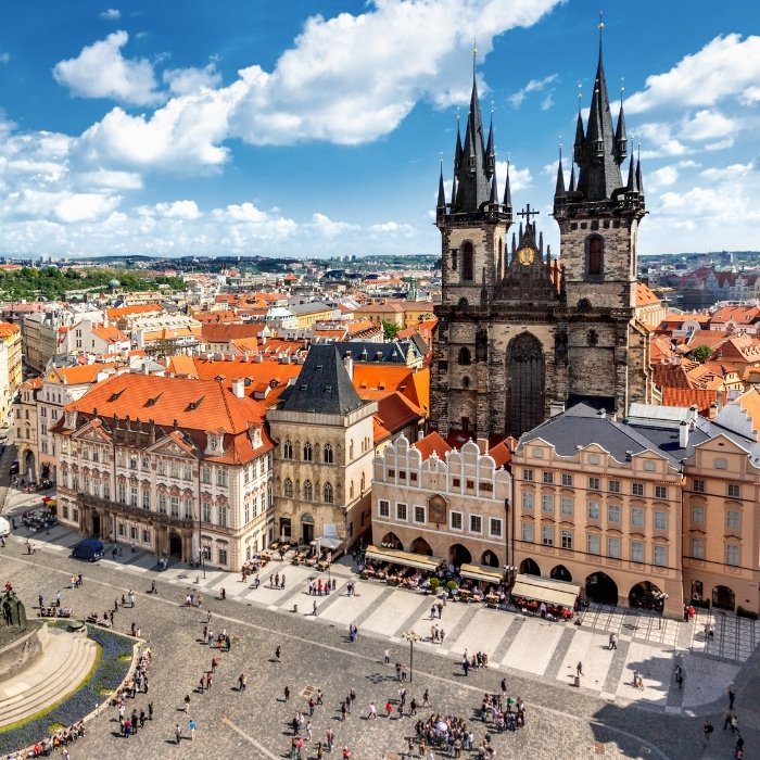 Prague's Old Town Square and towers seen across the rooftops
